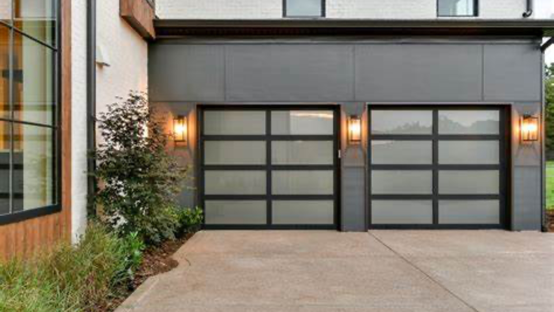 Stylish new garage door with black-framed glass panels