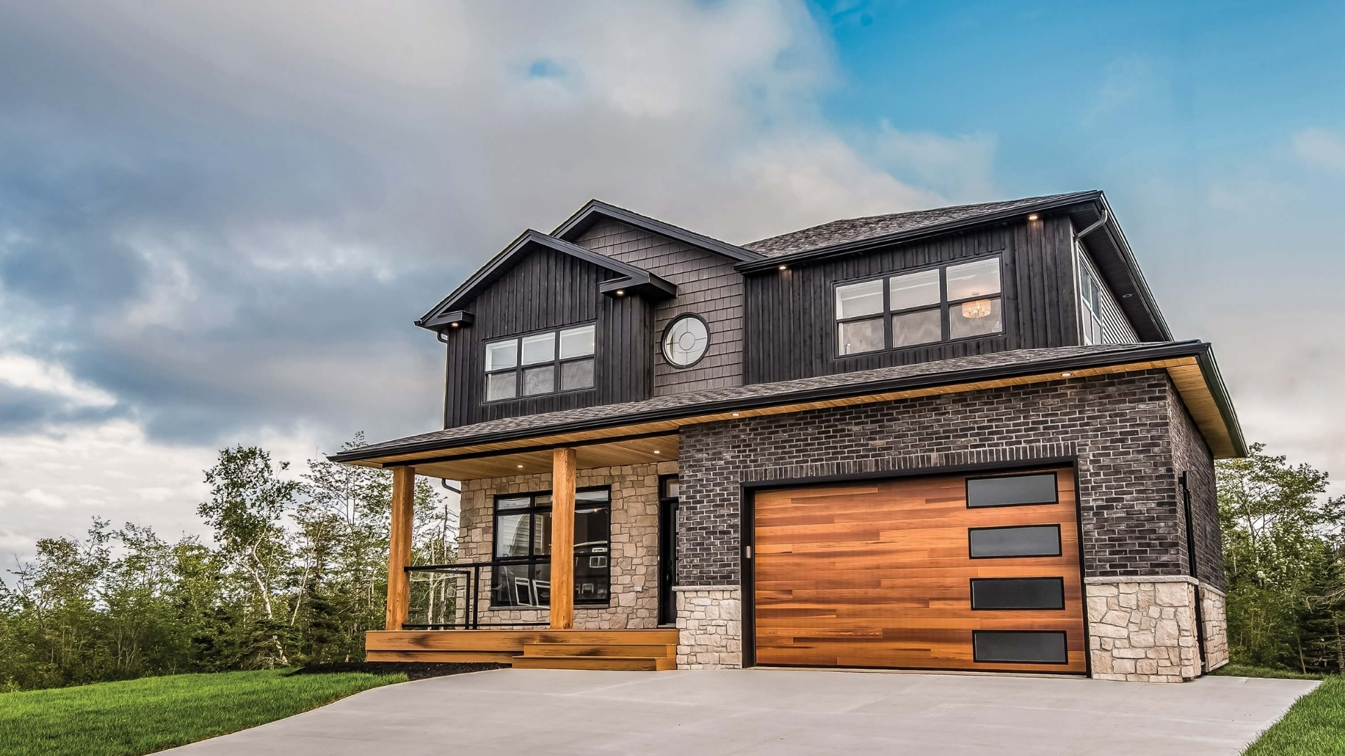 Modern house with a garage door made of wood material.