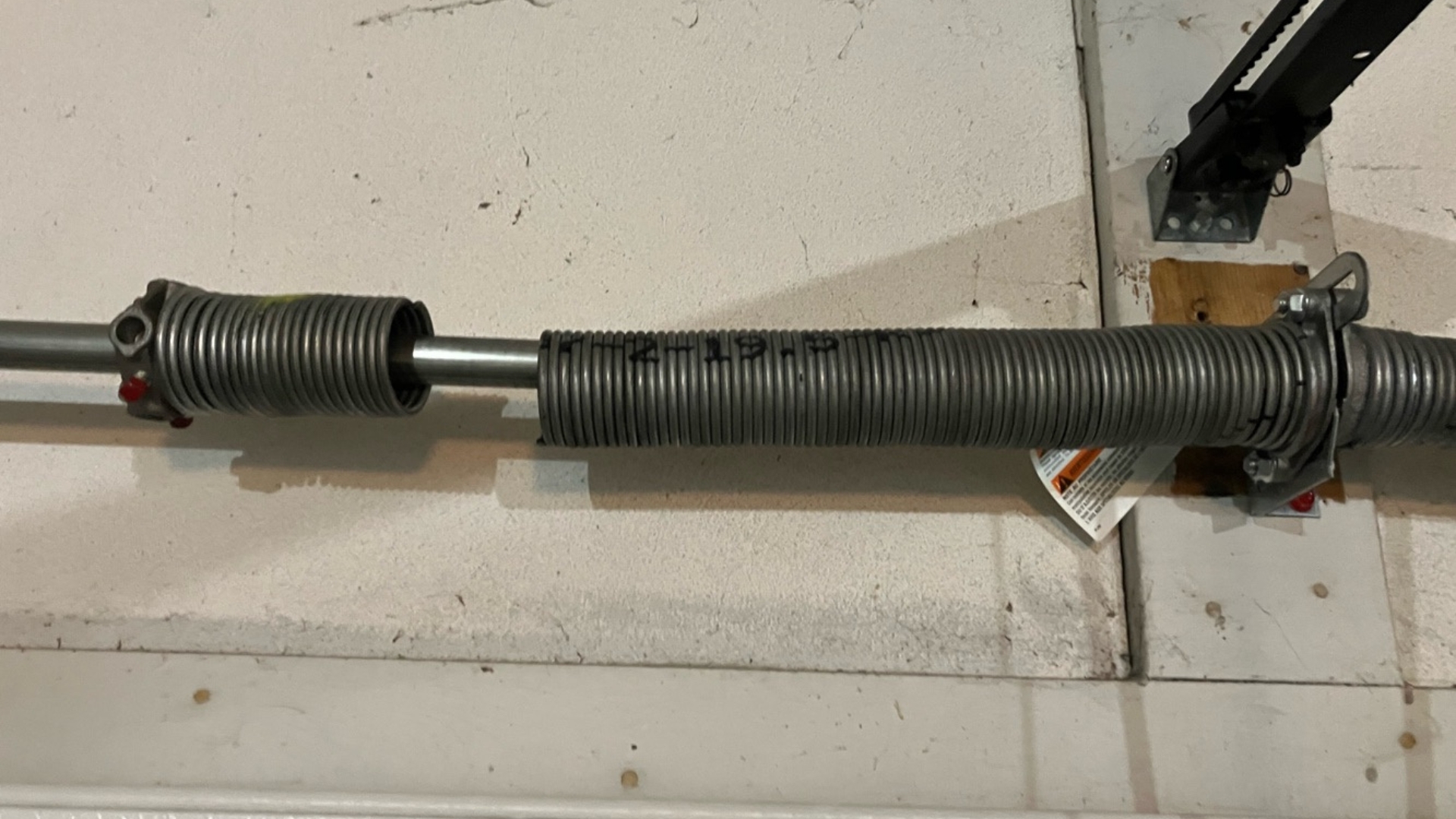 A broken garage door spring