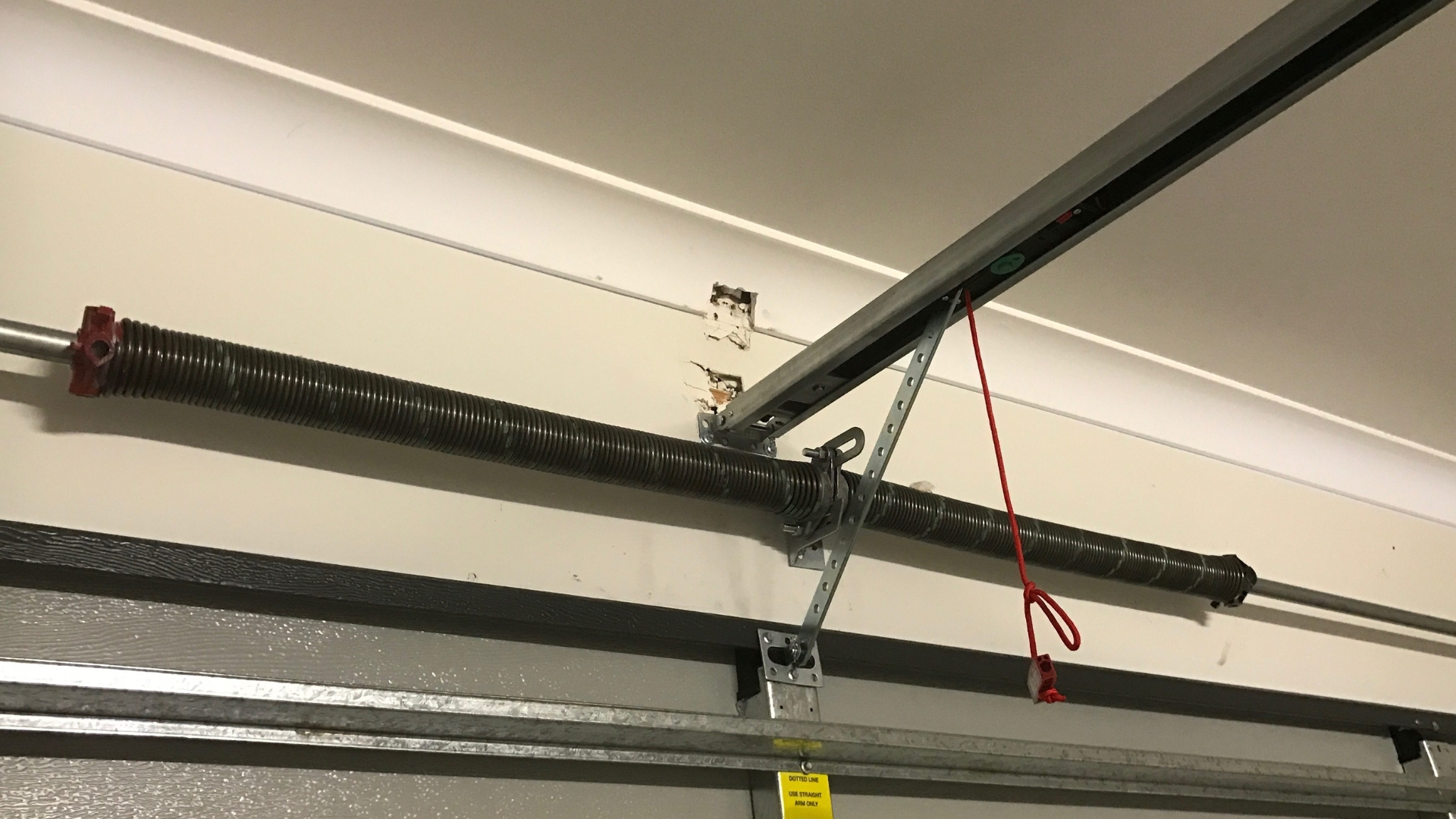 New garage door springs installed in an overhead door