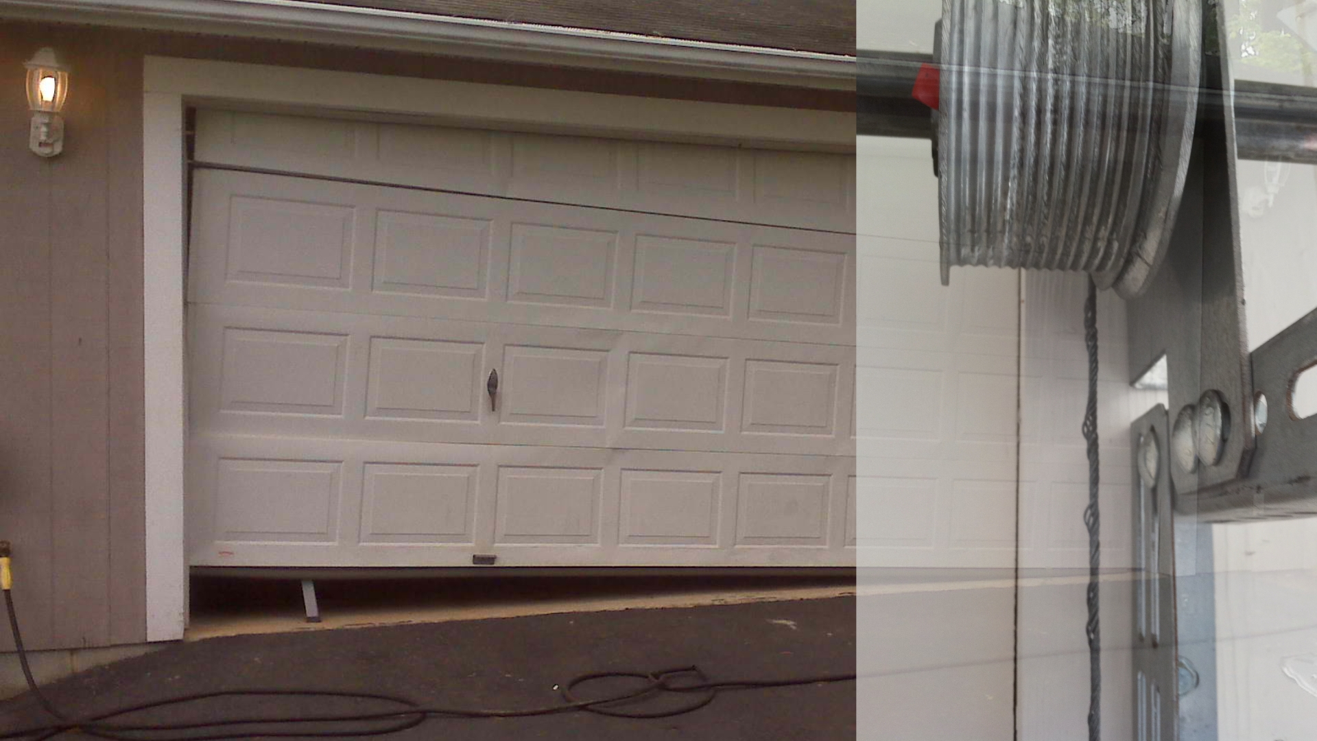 A garage door stuck due to broken cables and off-track alignment