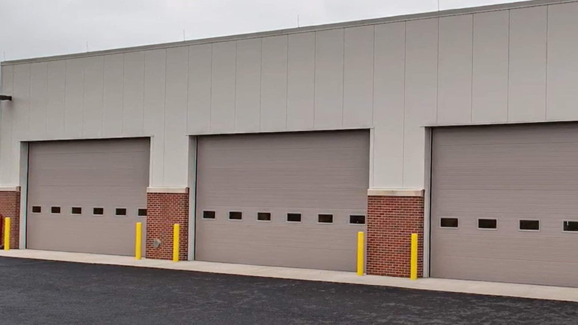 A secure facility with multiple commercial overhead doors