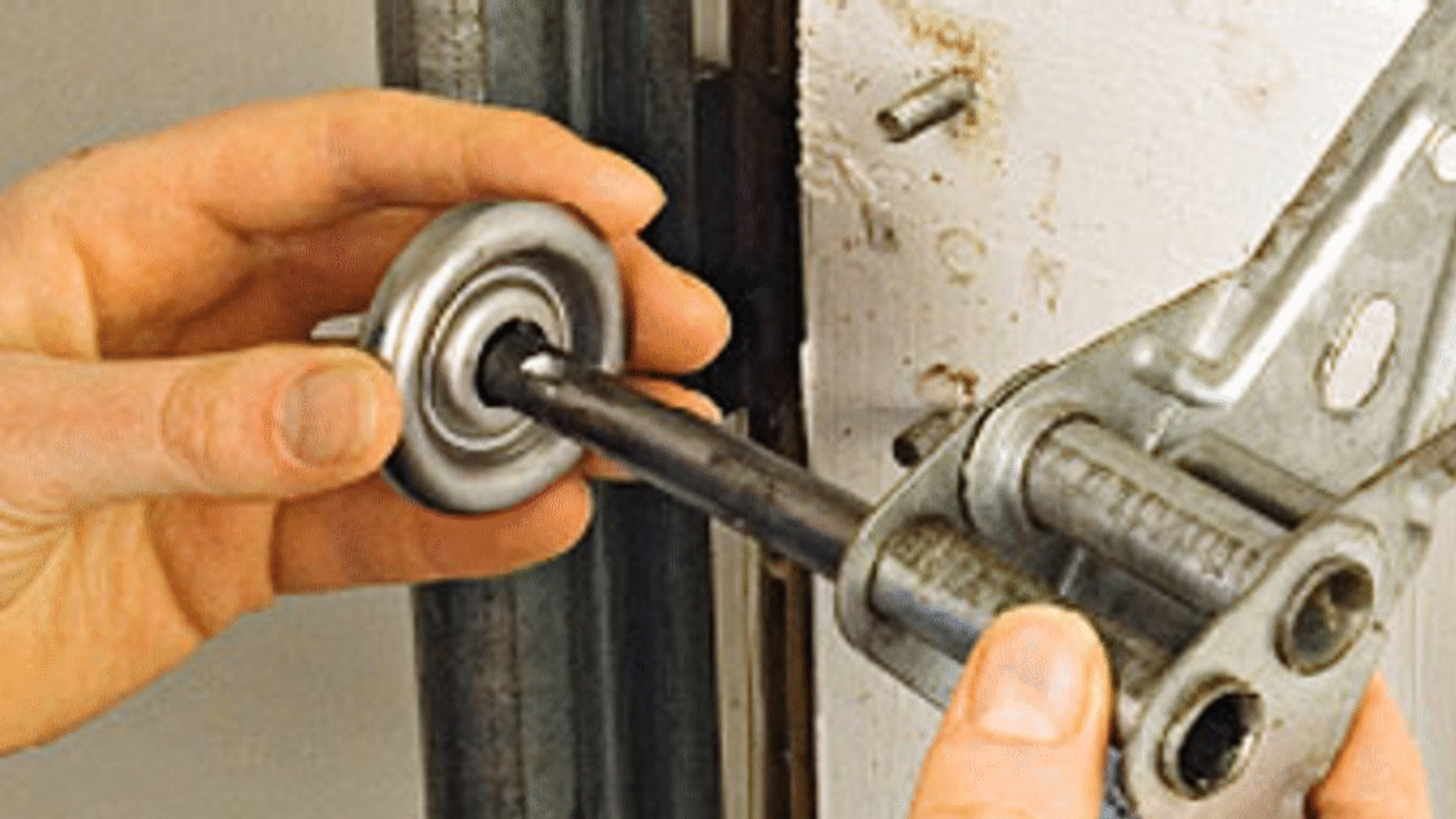 Fixing a noisy garage door by replacing worn-out rollers.