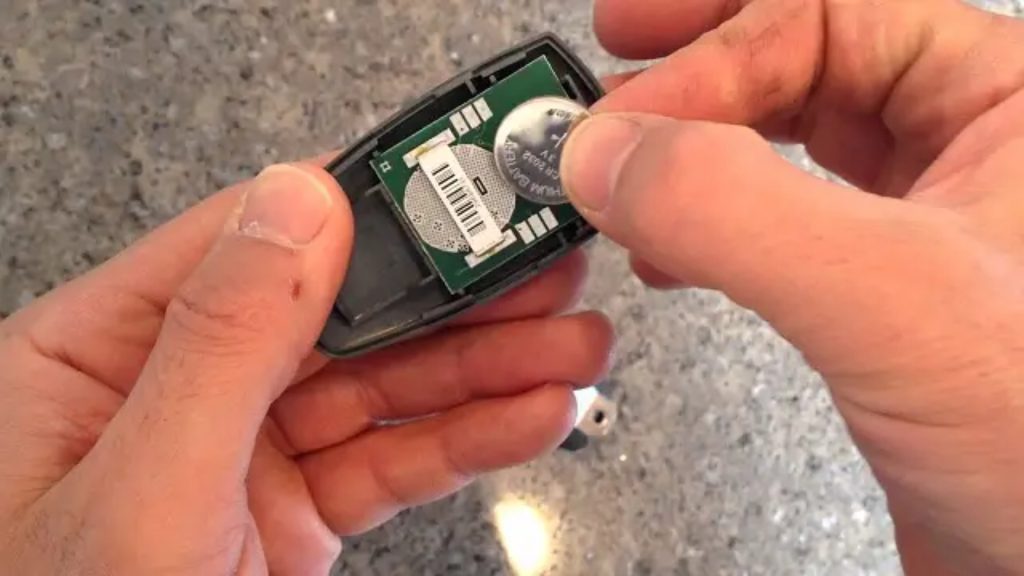 Replacing the battery in a remote to fix a stuck garage door.