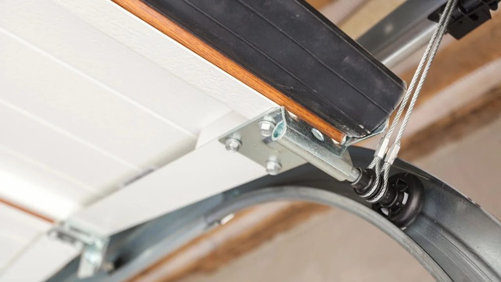 Replacing garage door cables before they break prevents the door from getting stuck.