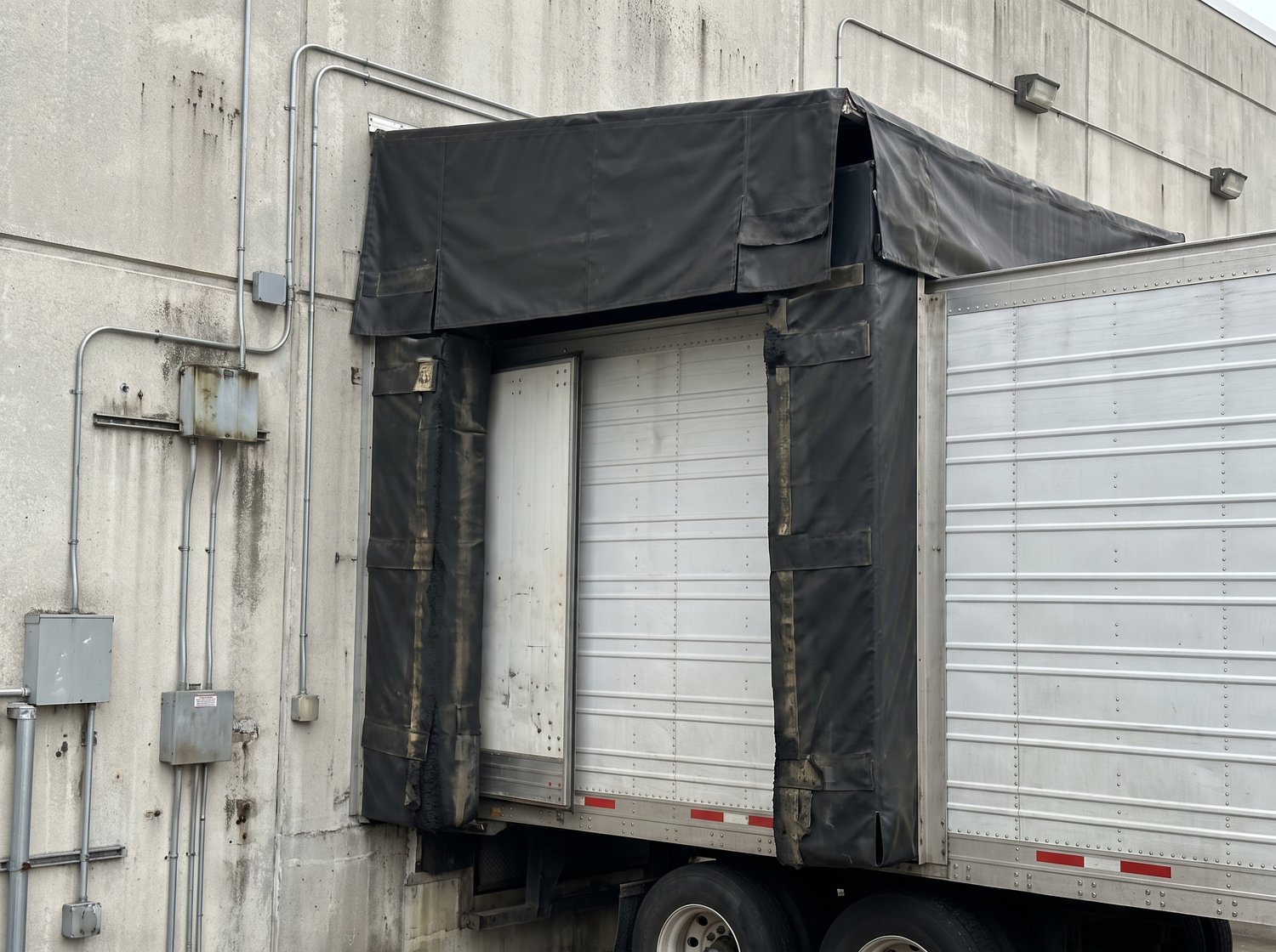 Loading dock seals and shelter with a trailer backed in at a Houston warehouse